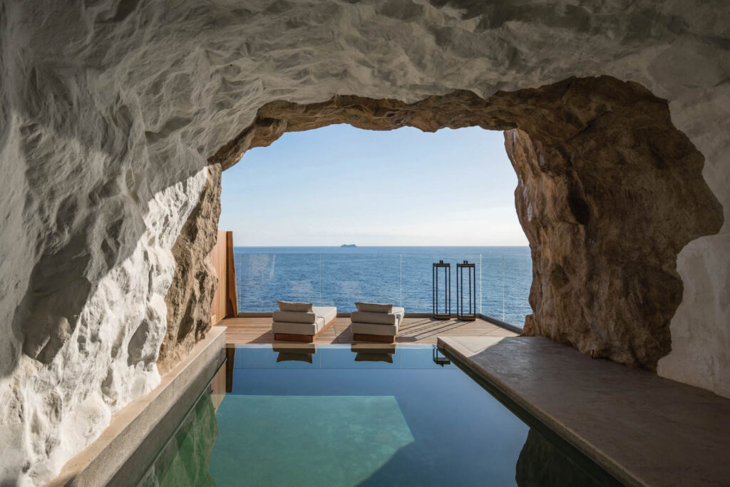 a private saltwater pool cut into a cliff face as part of a resort