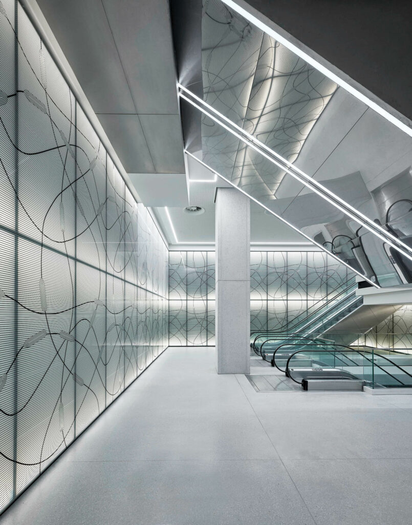 a graphic of curving lines covers a wall in front of a staircase in this Istanbul cruise terminal