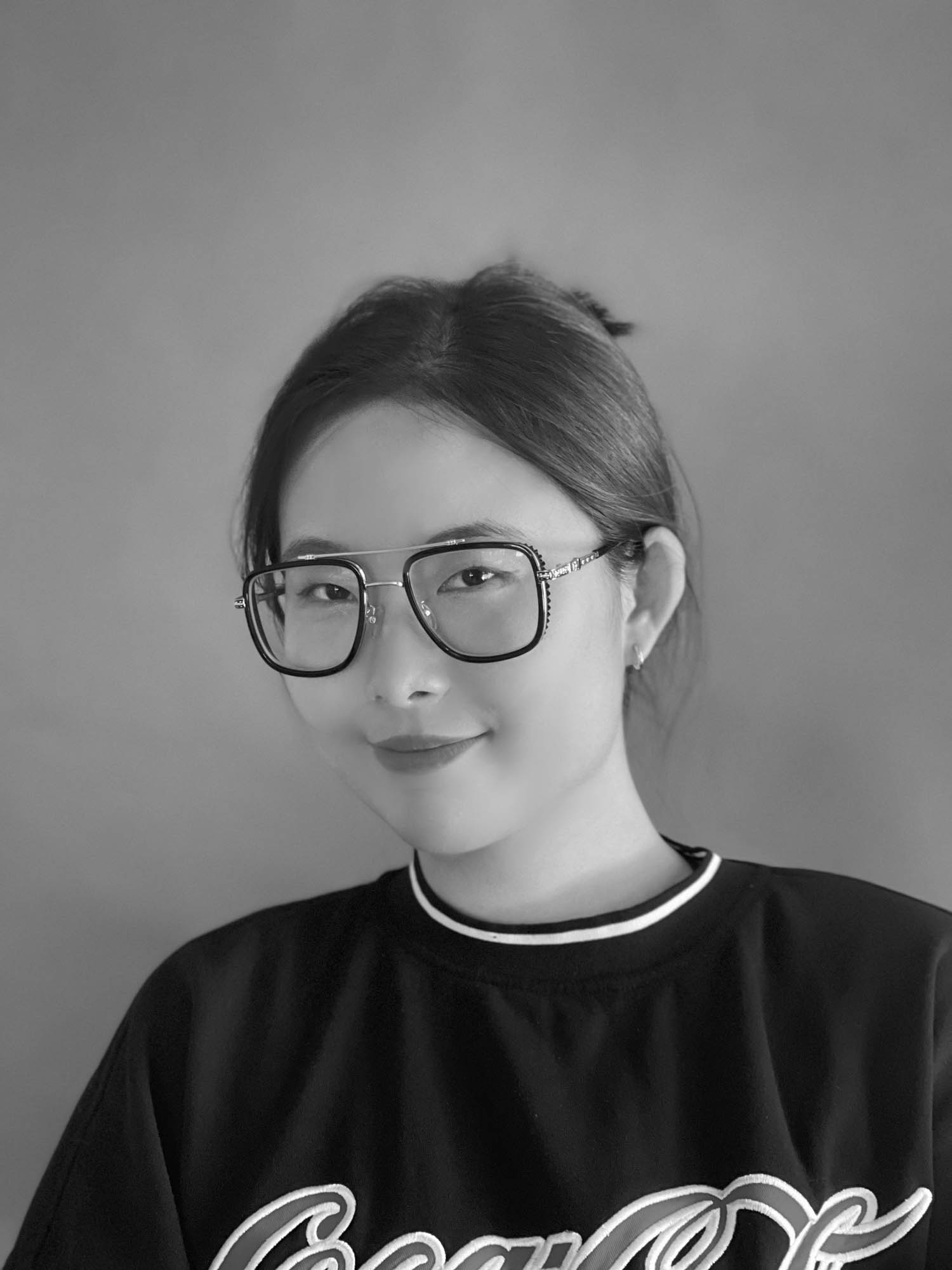 A black and white headshot of Qian Wang, an Interior Design Best of Year Student winner