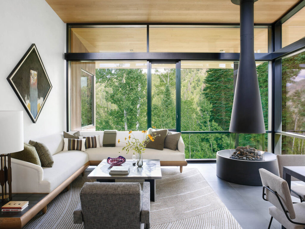an Aspen's home guest sitting room with views of the trees