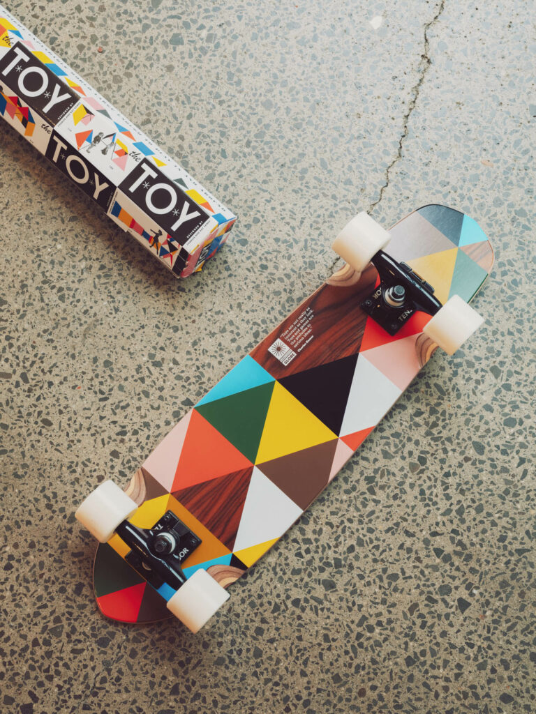 a mini skateboard with a pattern from "The Toy" by the Eames's