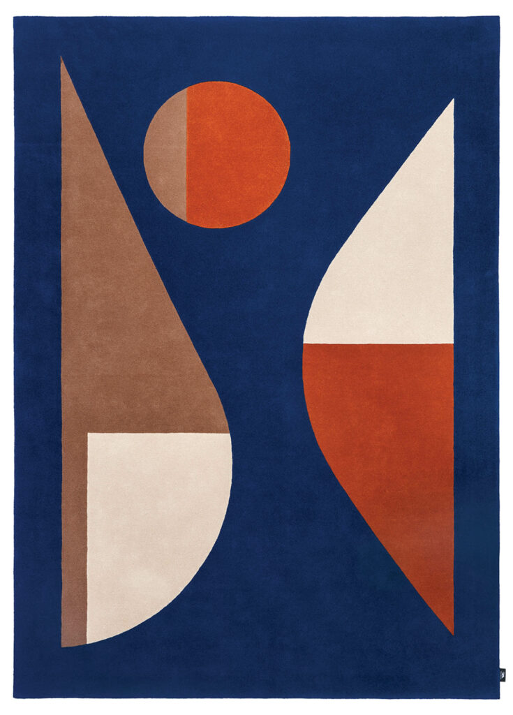 a rug with an abstract pattern in blue, brown, cream, and red