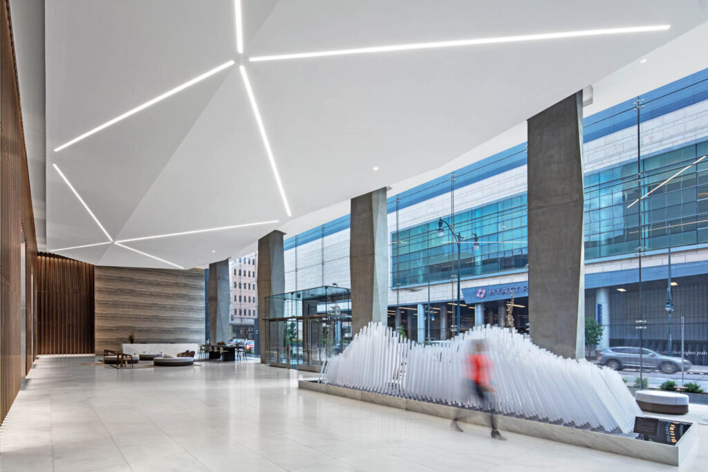 linear LEDs in the ceiling of an office tower draw attention to angular planes