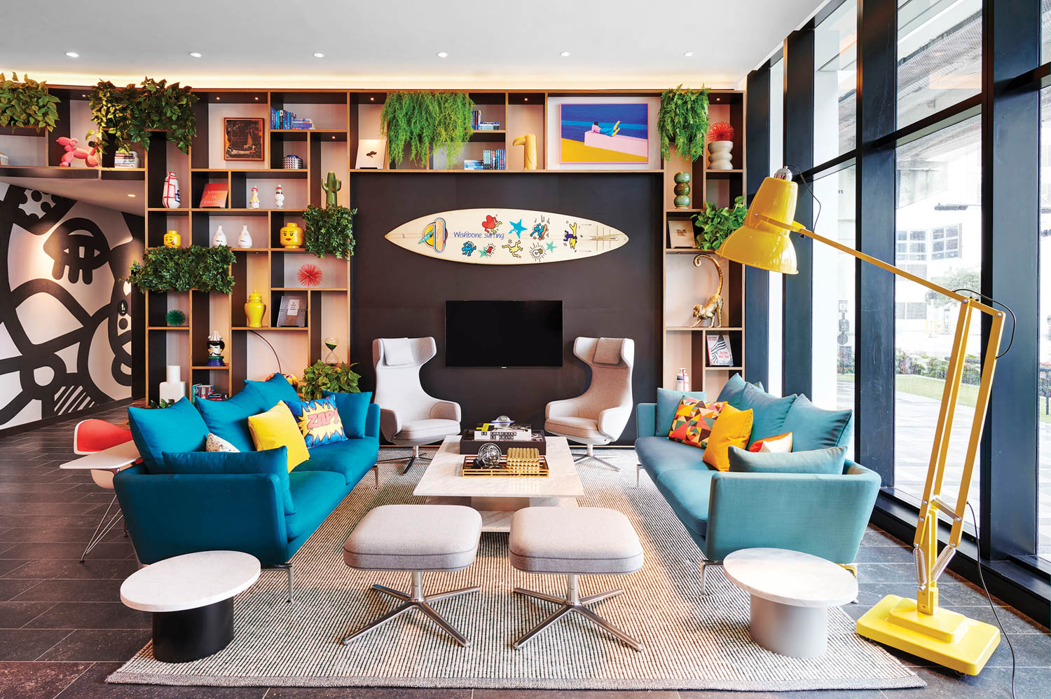 a living room with beach and cruise ship inspired furnishings in a Miami property