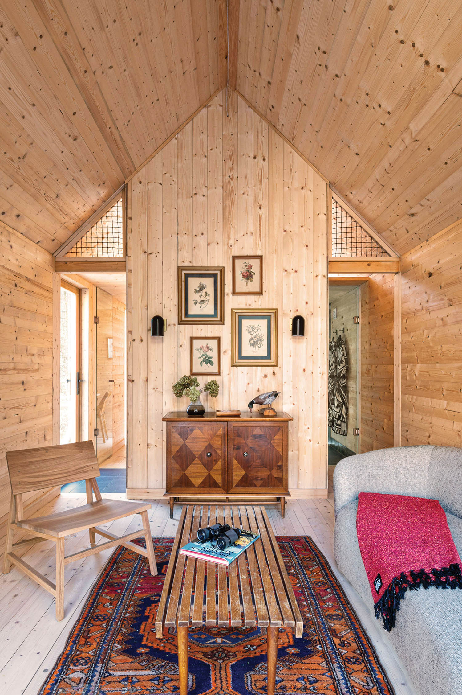 inside a minimalist, midcentury furnished a-frame cabin