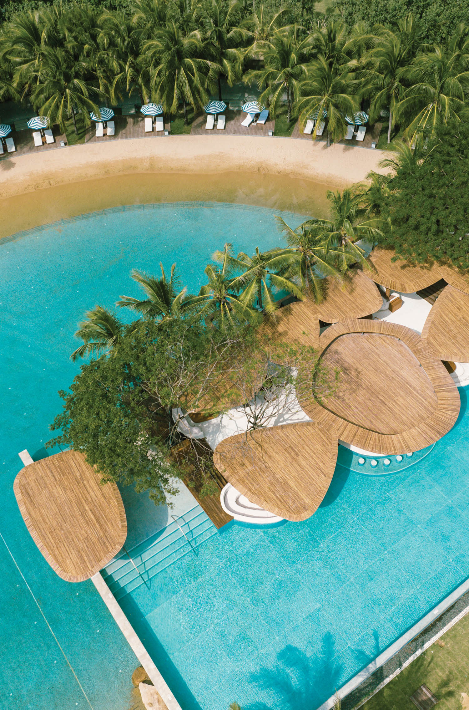 a birds-eye view of the Beach Club at the Sanya Edition by Marriott