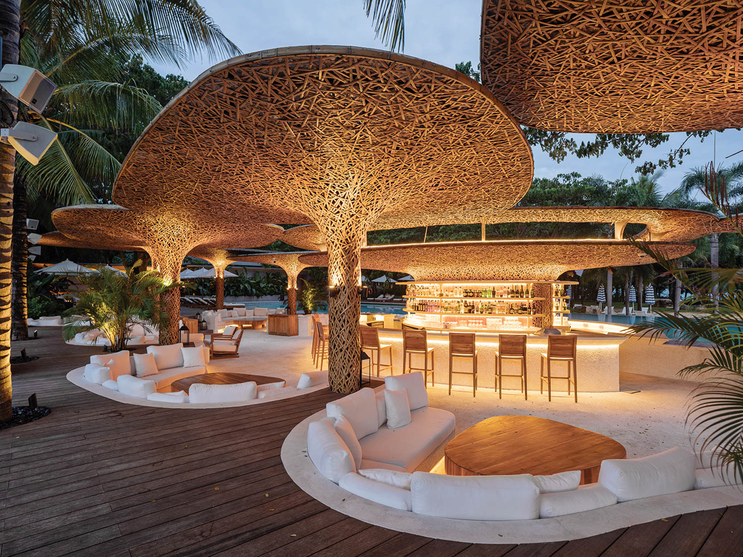 a poolside lounge lit up at night