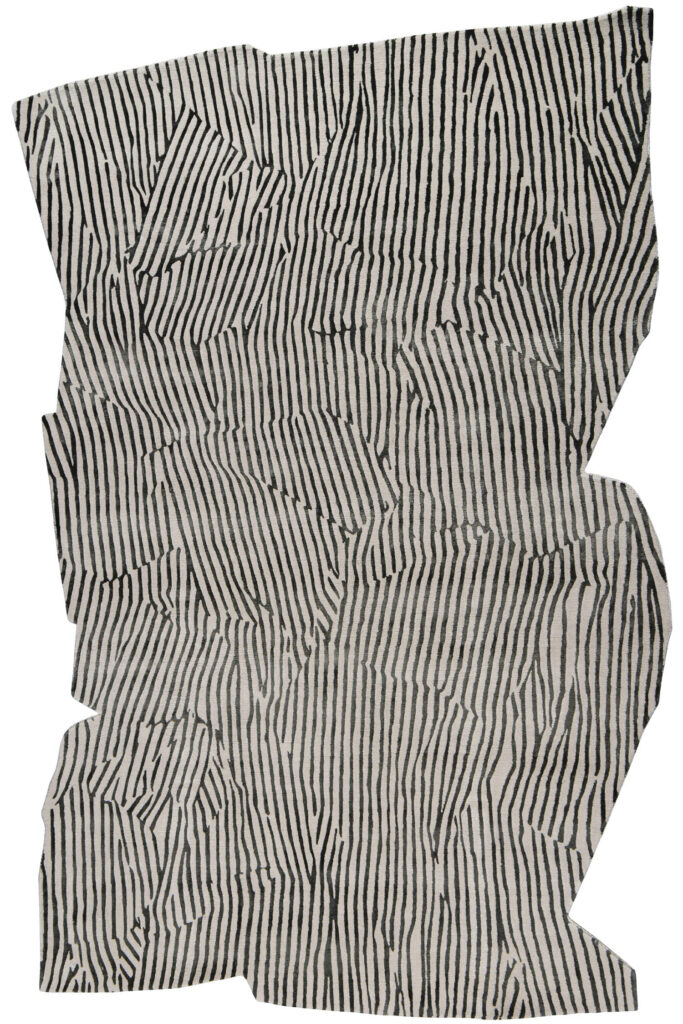 a rug made of amorphous black and white stripes 