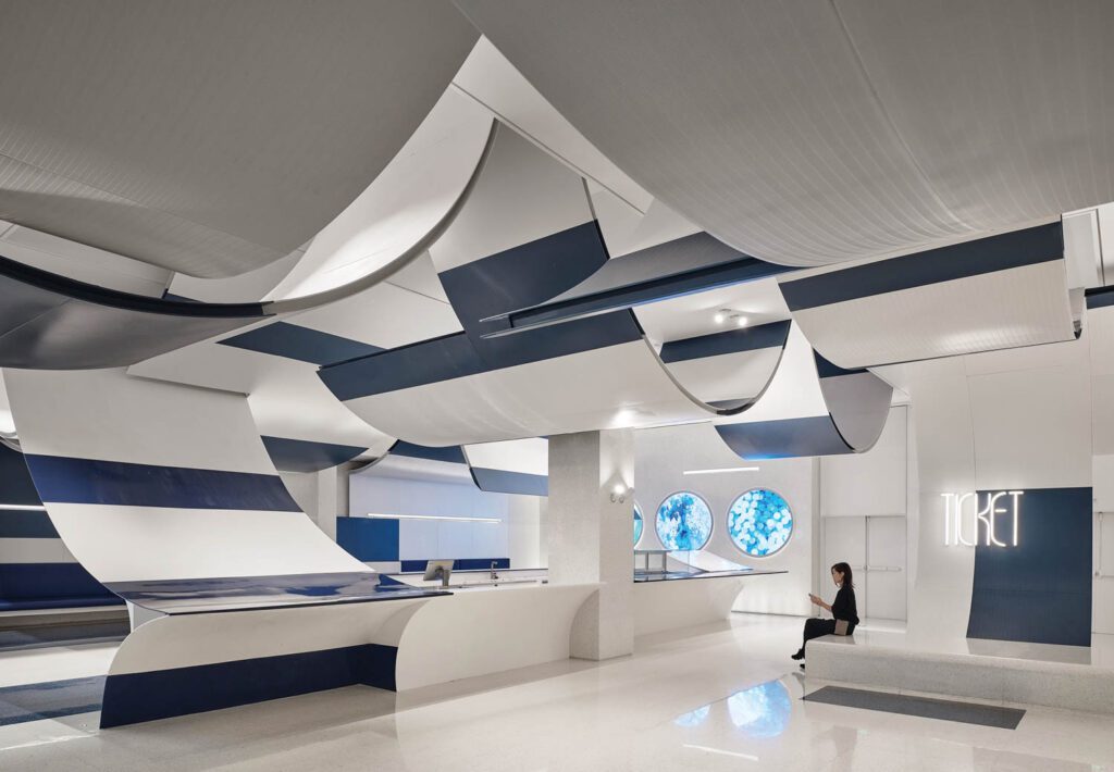Blue and white panels loop throughout this cinema in Shenzen, China.