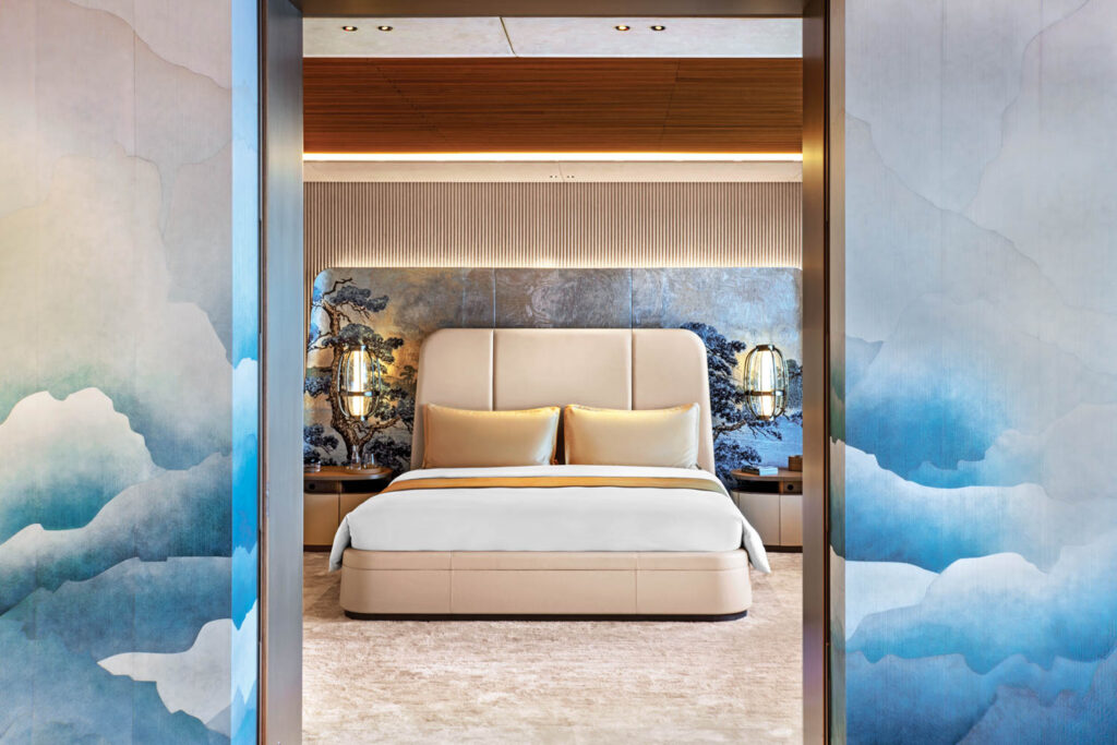 the main doors to the bedroom in this yacht are finished in a cloud-like mural