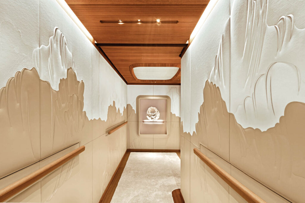 a coral reproduction in resin in the hallway of a luxury yacht