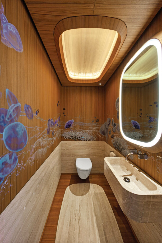 a powder room with jellyfish painted on the wall
