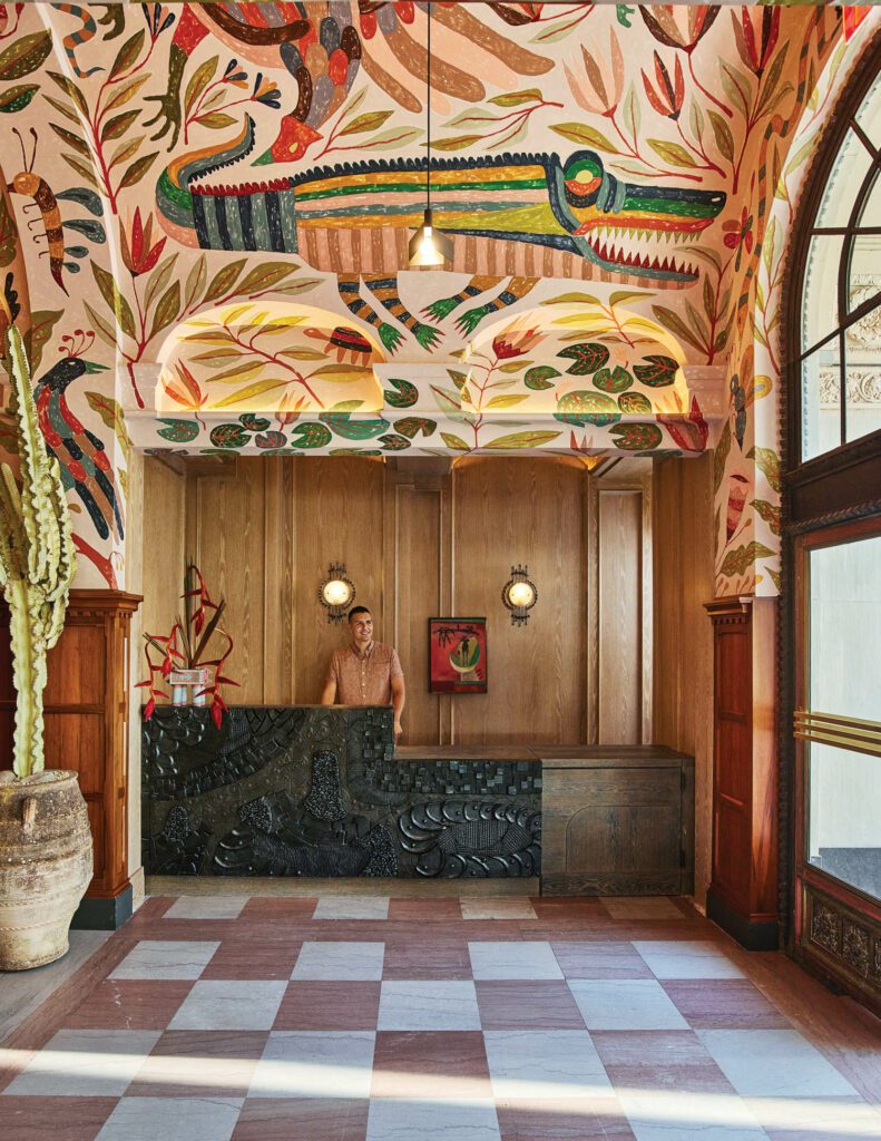 Anchored by existing marble flooring, reception is composed of a desk by Morgan Peck and a mural by Abel Macias, both local artists.