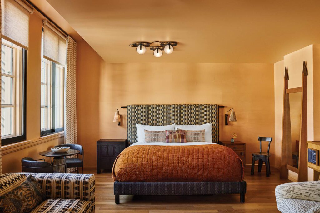 A study in earthy colors and custom furnishings, a junior suite has stained oak flooring.