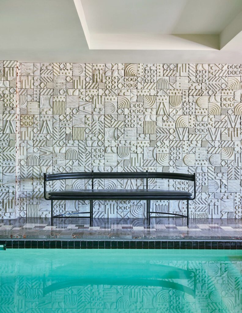 The pool suite incorporates the YWCA’s indoor pool as well as a 1970’s Alky bench by Giancarlo Piretti and a newly commissioned ceramic mural of abstracted tire treads and cacti by L.A. sculptor Ben Medansky.