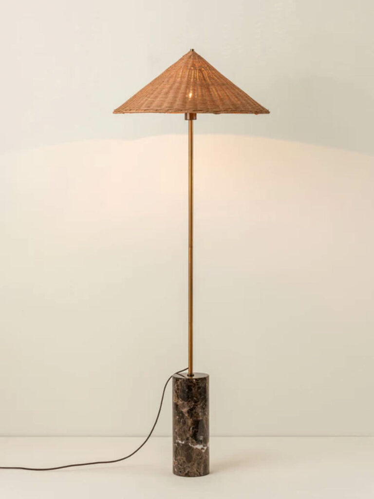 A floor lamp with a tan shade by Lights&Lamps