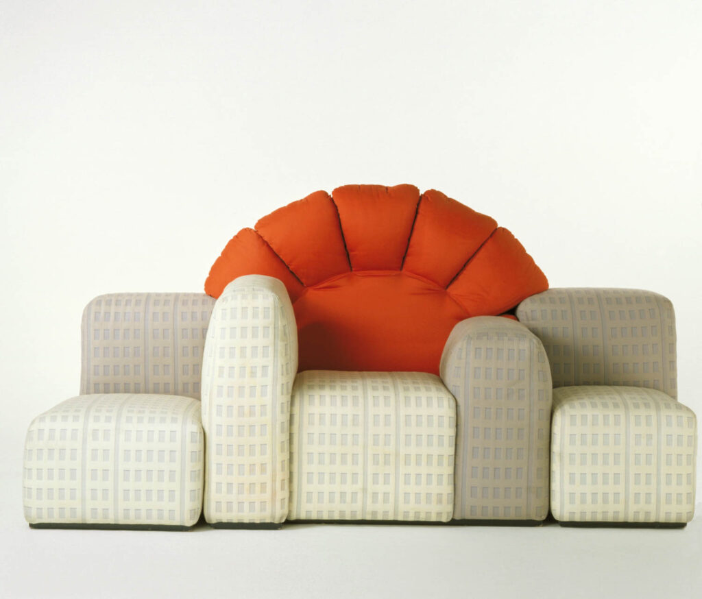 a modular couch with a red upholstered arch