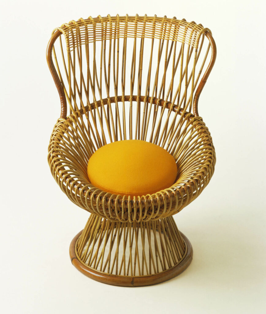 a chair made of woven ropes with a yellow spherical center