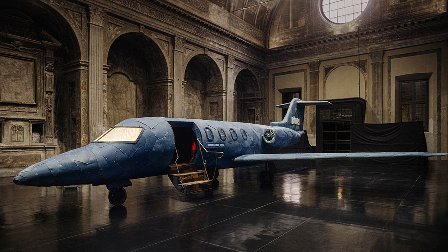 a denim airplane in an installation at Milan Design Week