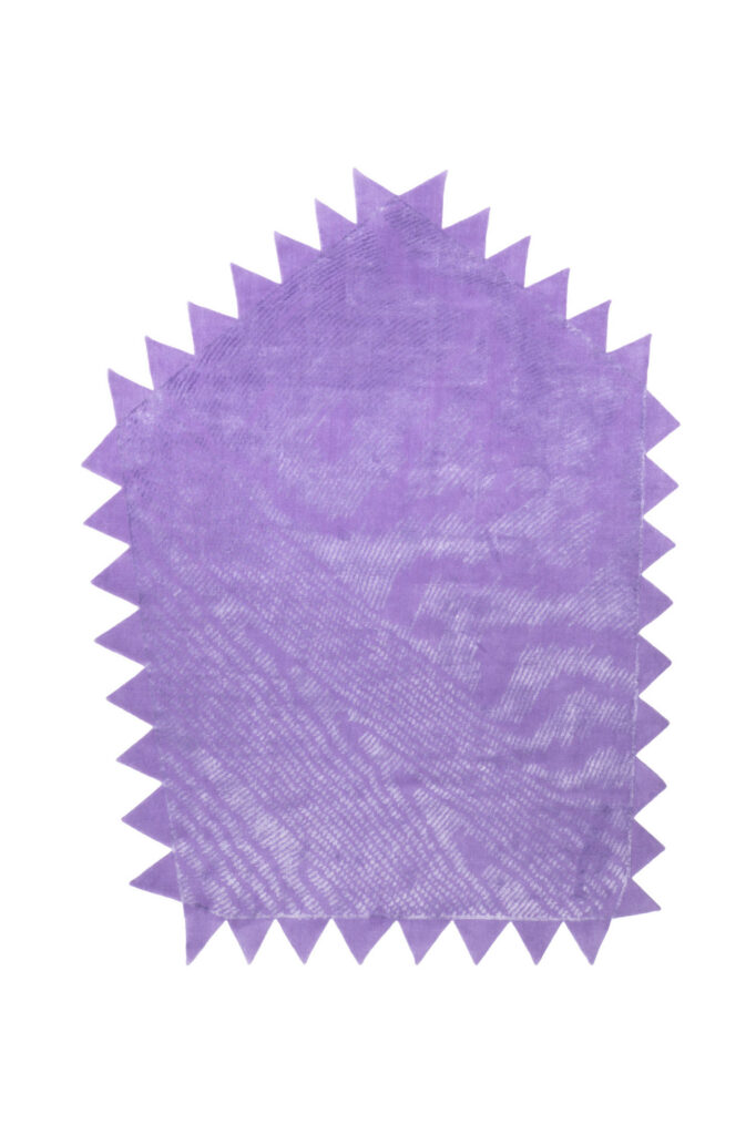 a purple rug with pointed edges and a pattern like the rings on wood and grain