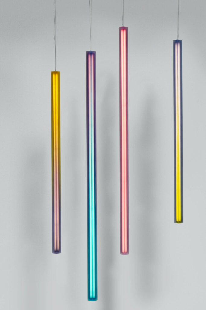 pendant lights made of rods of differing colors