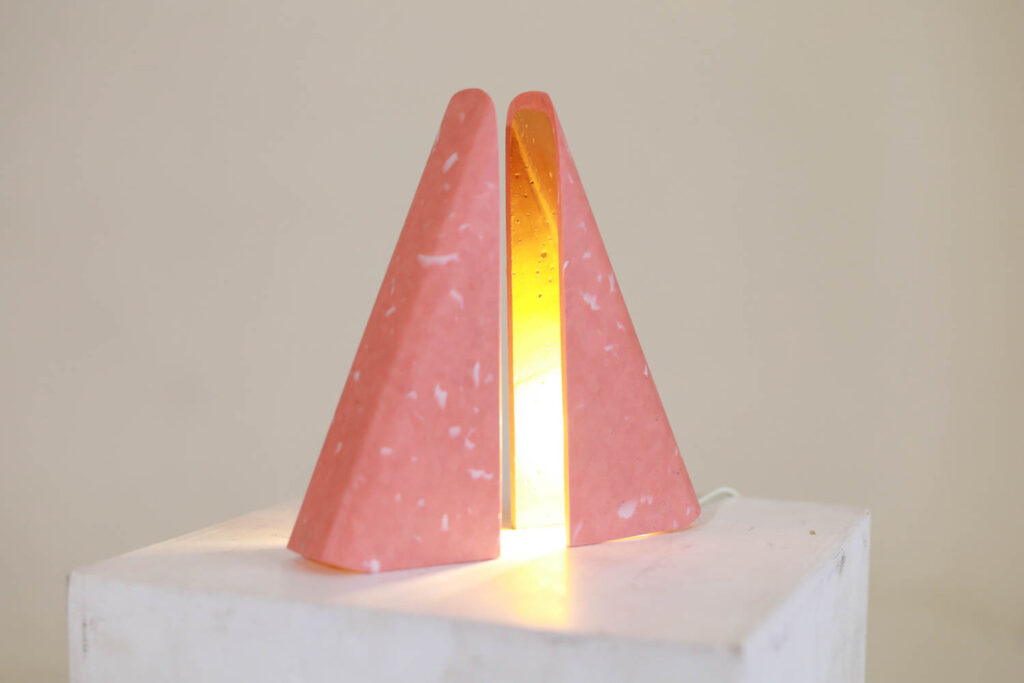a light made of two pink triangular pieces