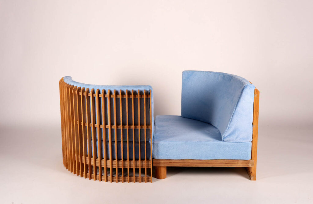 a blue couch with a built in radiator