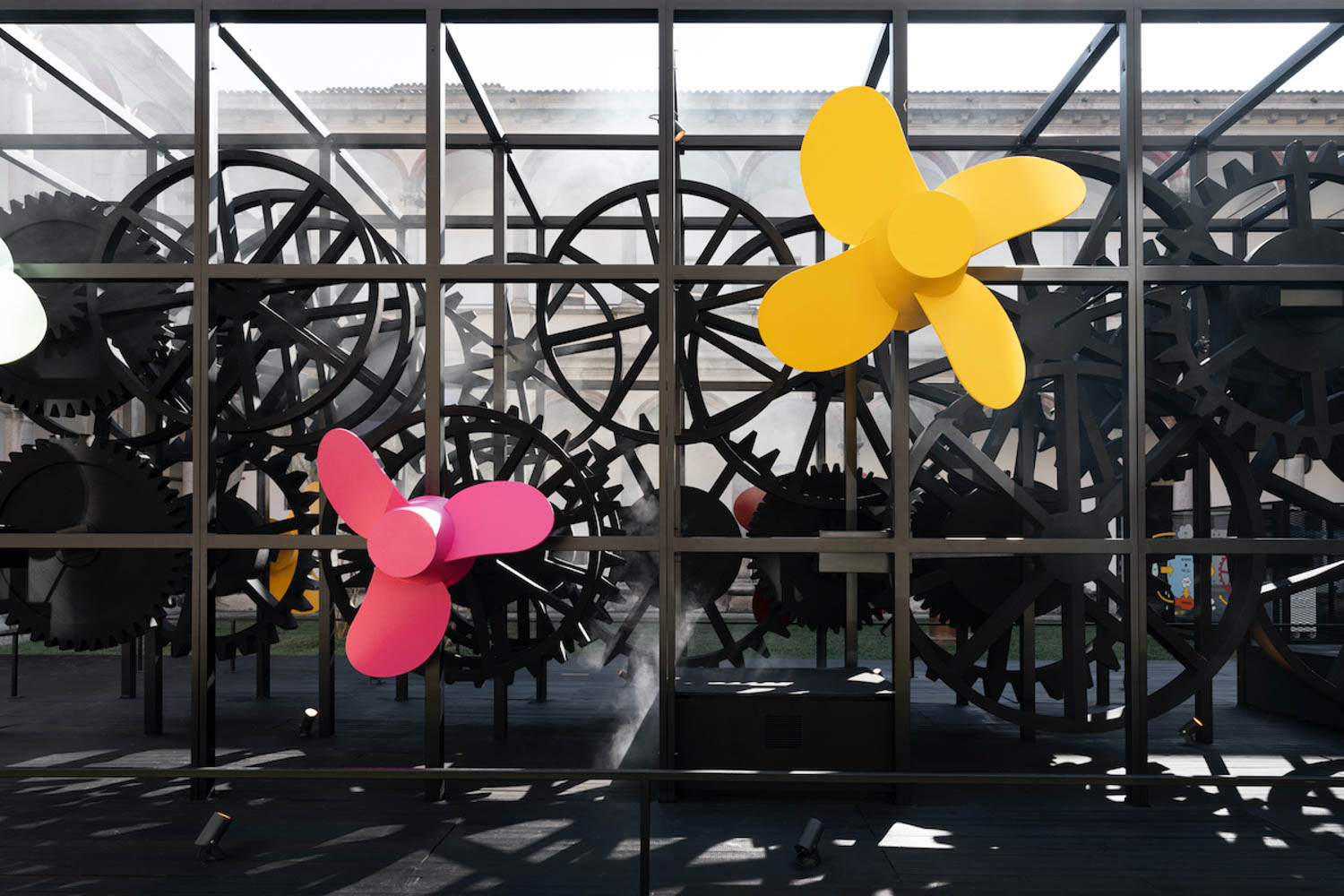 pink and yellow floral shaped propellers are part of a Milan Design Week installation