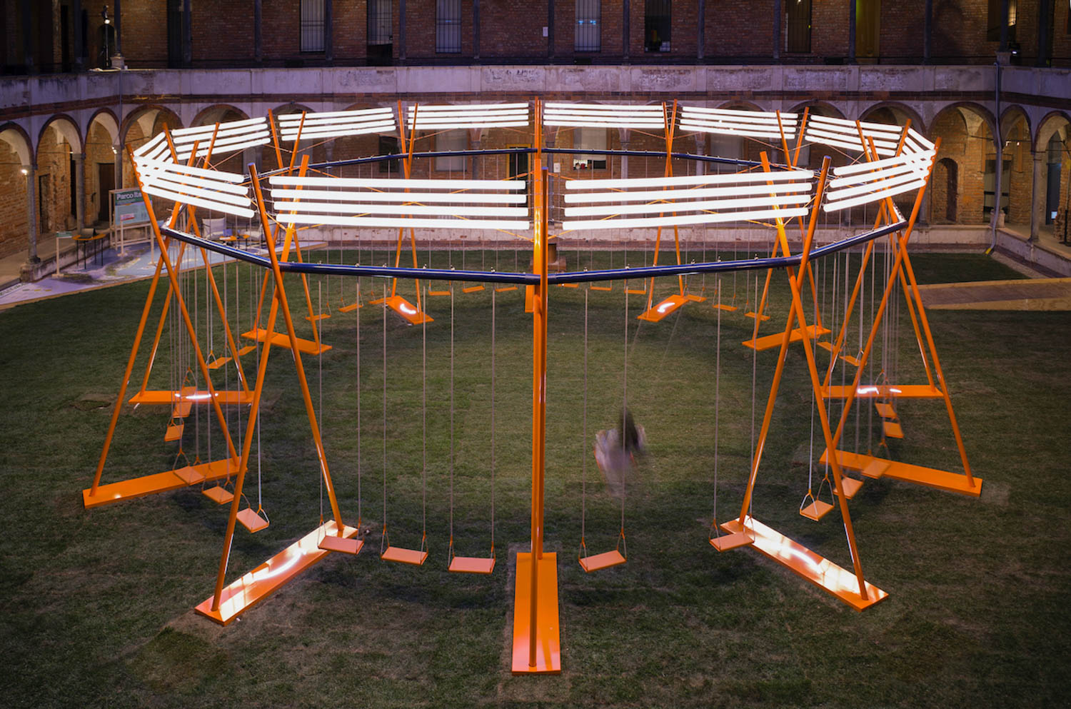 an oversized swing set with glowing lights