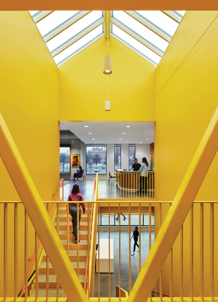 A bright yellow staircase in Family Tree clinic