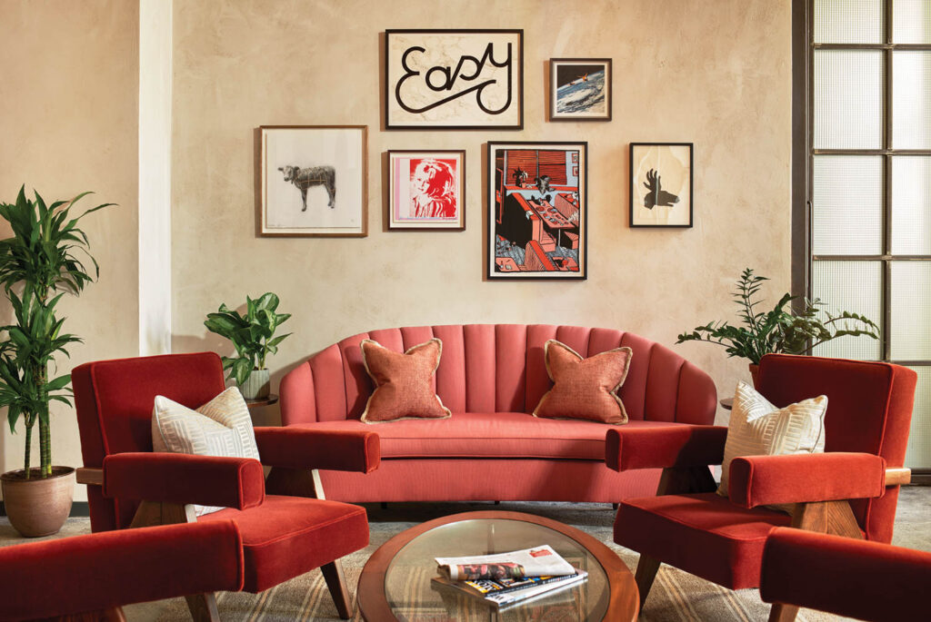 plush seating in a lobby with artwork on the walls