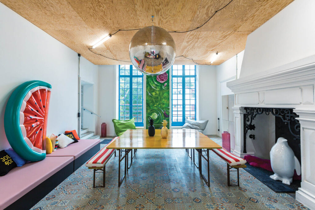 a watermelon pool float and a disco ball add to the beachy vibe in this seaside French property