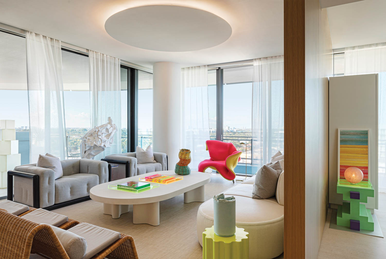 a built-in ceiling disc lights the living area of this home with neon accents throughout