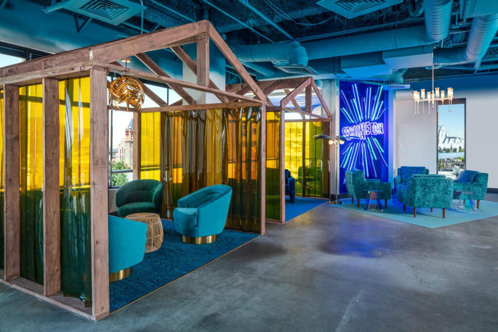 wooden cabanas surrounded by yellow curtains as part of Maximalist's design for Shinesty