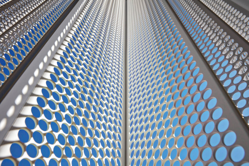 a building's screen made of perforated powder-coated aluminum 