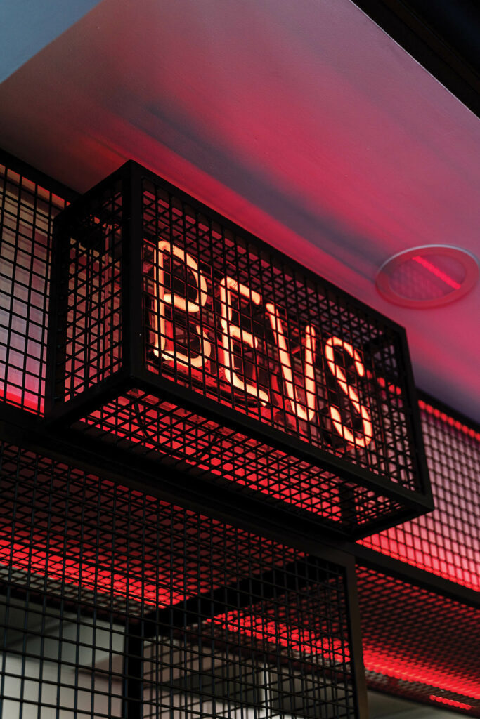 a neon sign that reads "Bevs"