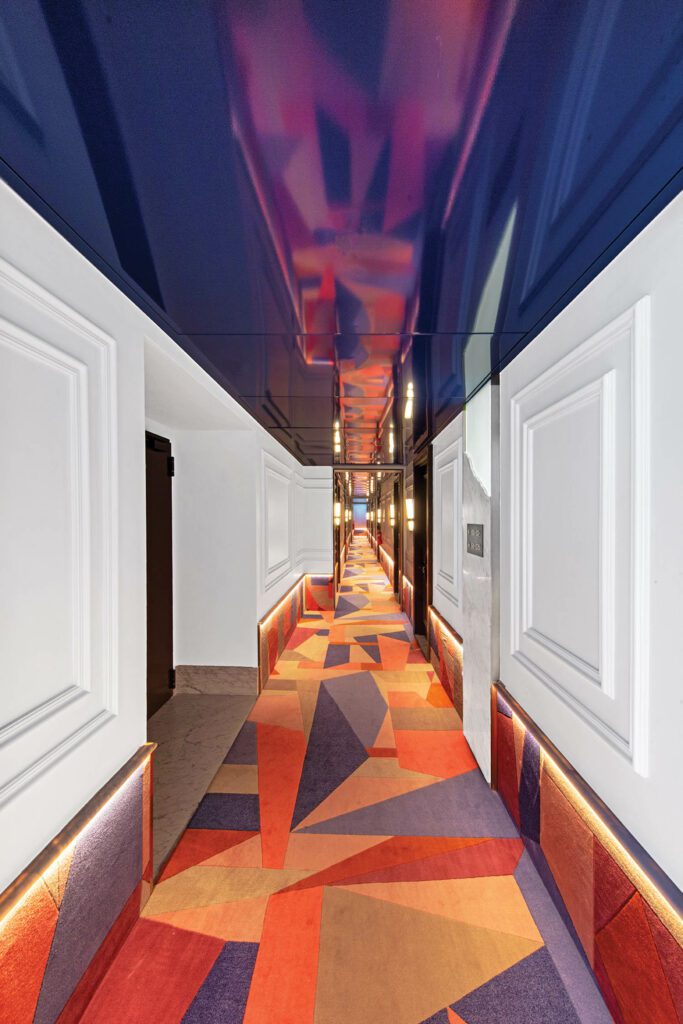 Custom wool corridor carpets extending up the walls for protection from luggage.