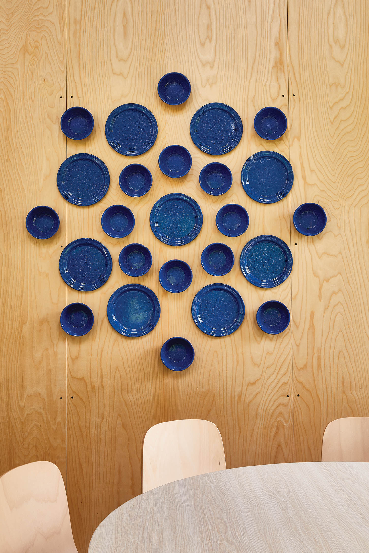 an installation made of cobalt camping-ware by Elizabeth Schnurstein