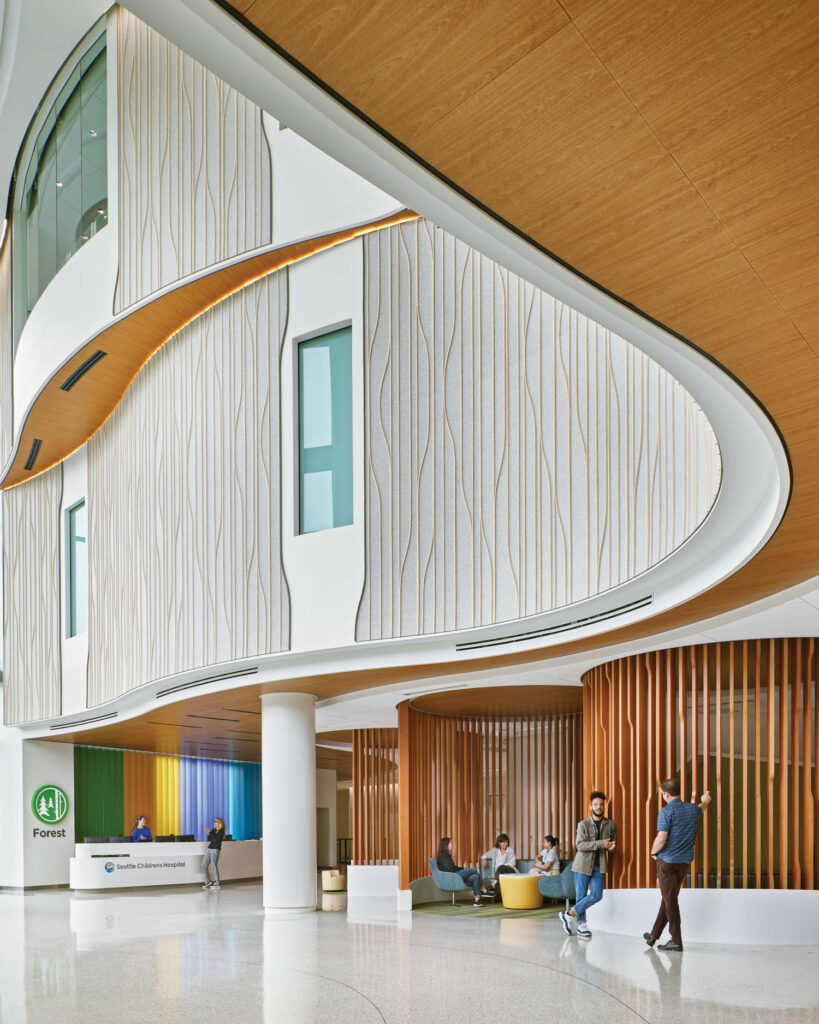 The curved facade of Children follow storybook wayfinding images in Building Care, Seattle Children’s.